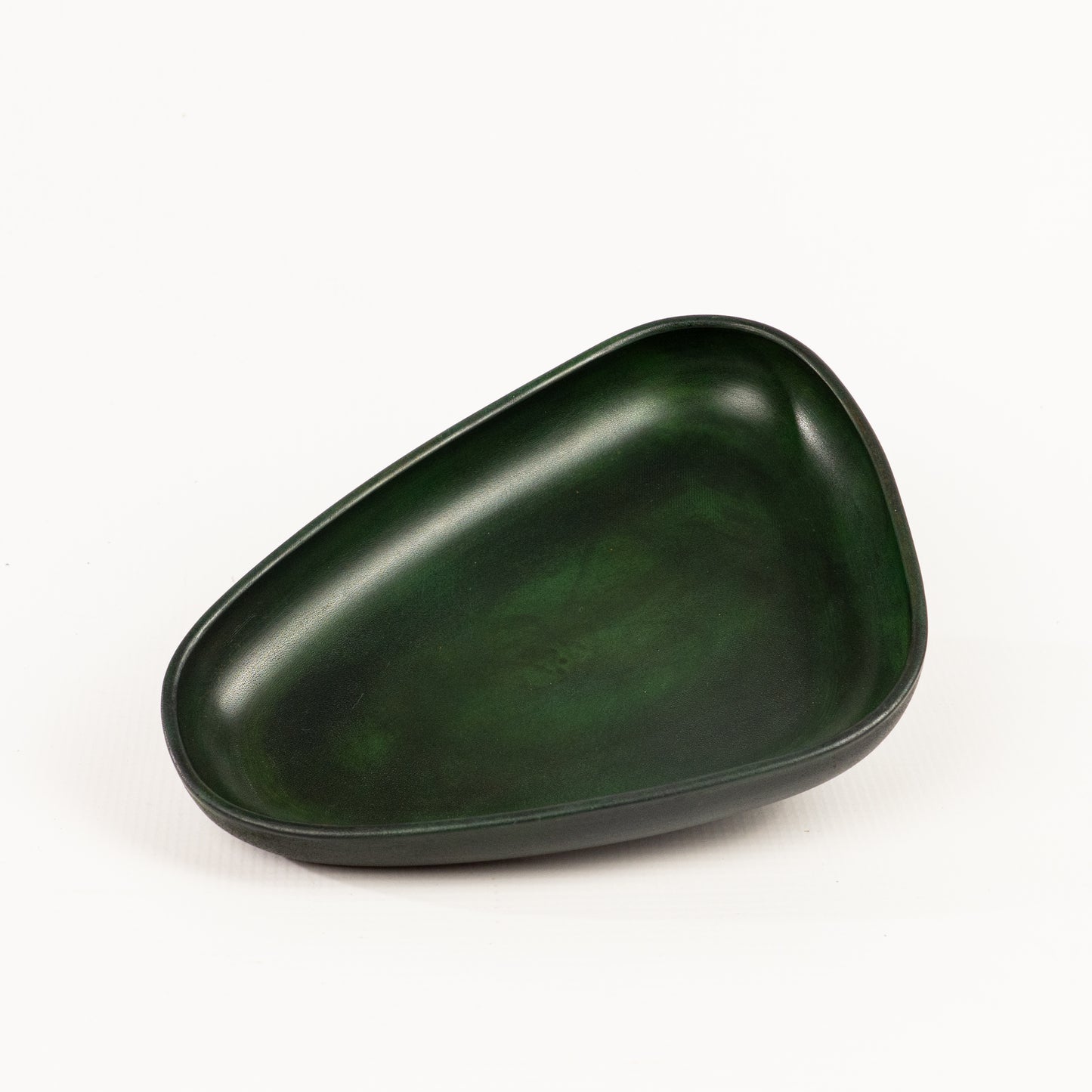 Green Hand Dyed 3D molded leather valet tray transforms any space into a sanctuary of sophisticated organization. Crafted using advanced 3D molding technology, every curve and compartment is perfectly contoured to keep your essentials in perfect order. Handcrafted by Atom Leather.
