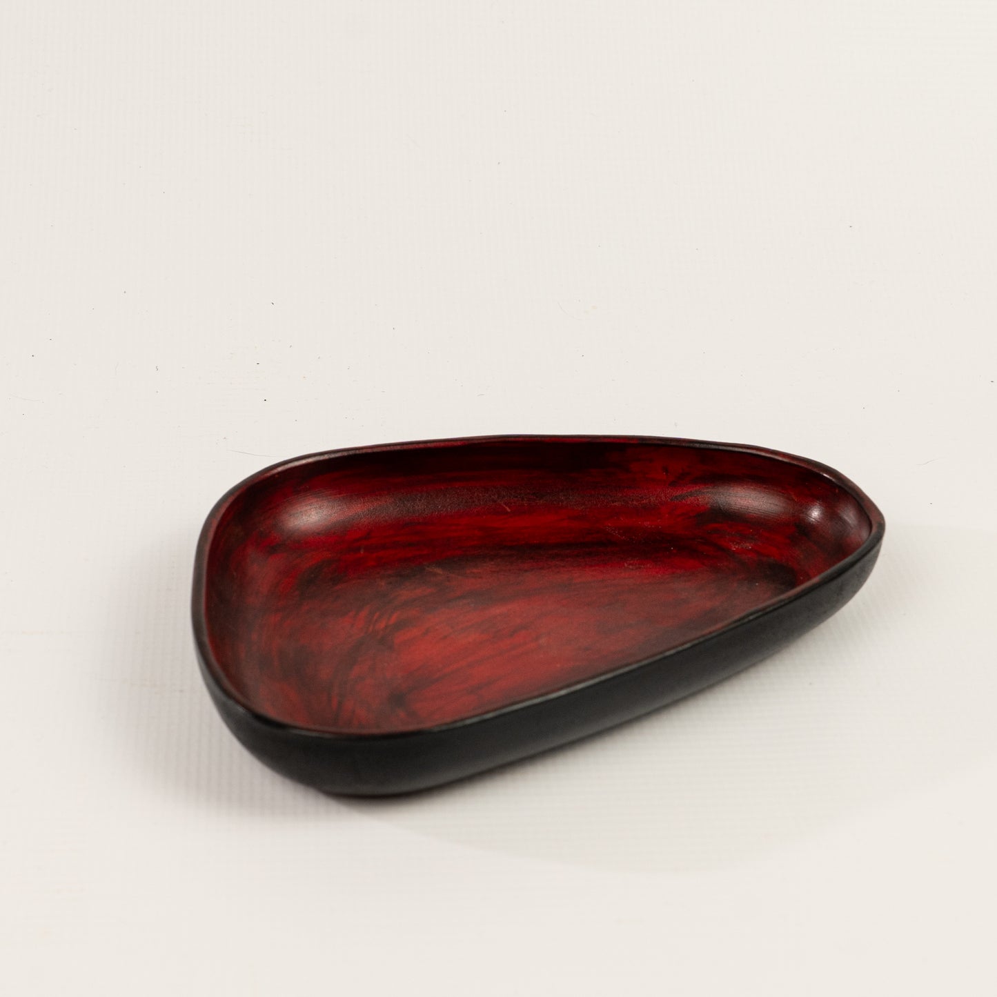 Red Hand Dyed 3D molded leather valet tray transforms any space into a sanctuary of sophisticated organization. Crafted using advanced 3D molding technology, every curve and compartment is perfectly contoured to keep your essentials in perfect order. Handcrafted by Atom Leather.