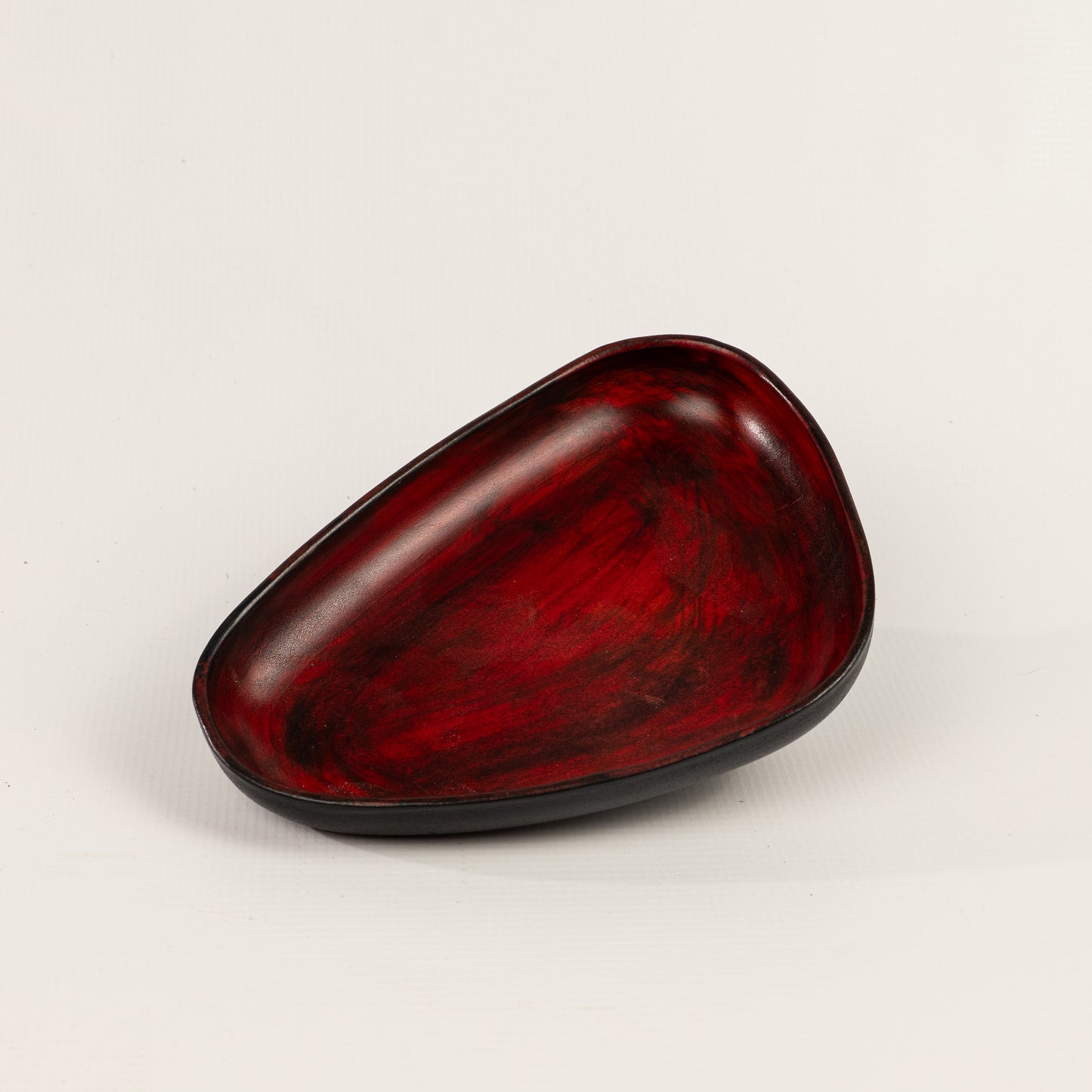 Red Hand Dyed 3D molded leather valet tray transforms any space into a sanctuary of sophisticated organization. Crafted using advanced 3D molding technology, every curve and compartment is perfectly contoured to keep your essentials in perfect order. Handcrafted by Atom Leather.