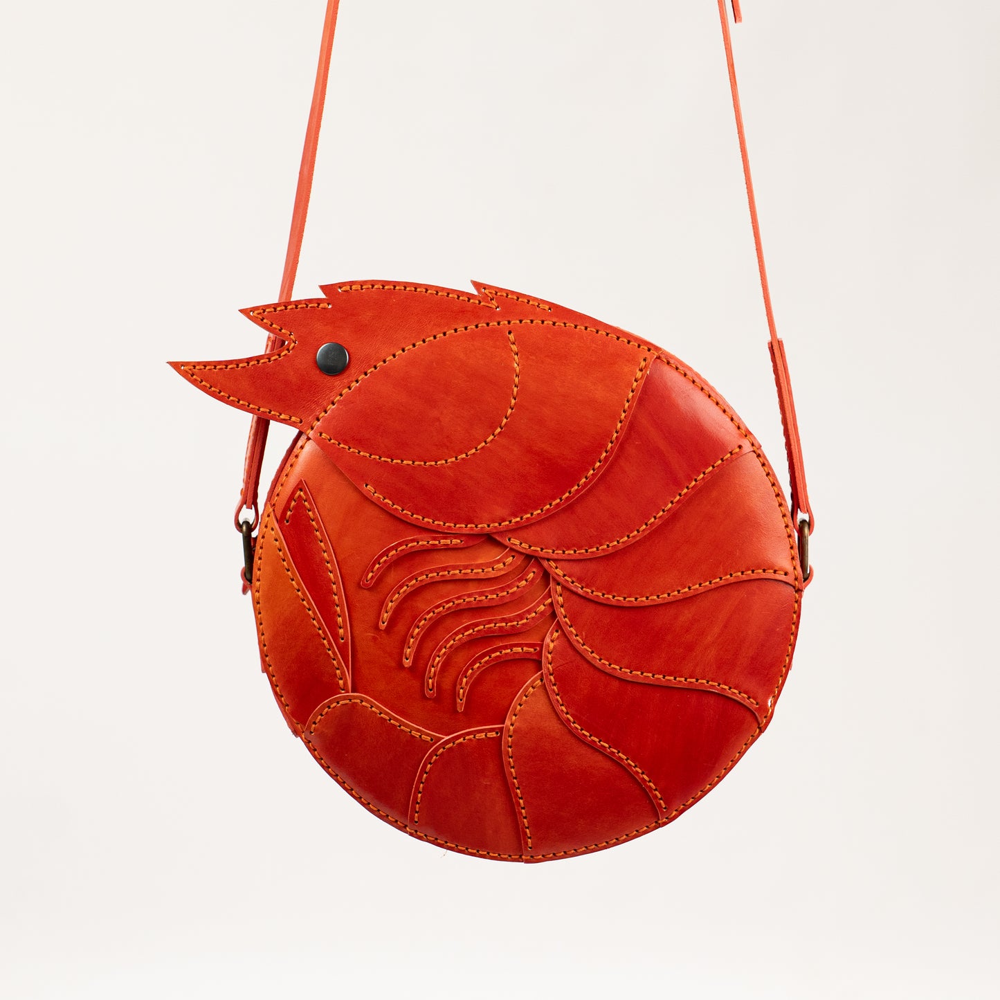 Limited-edition shrimp leather handbag with hand-dyed orange texture by ATOM LEATHER.