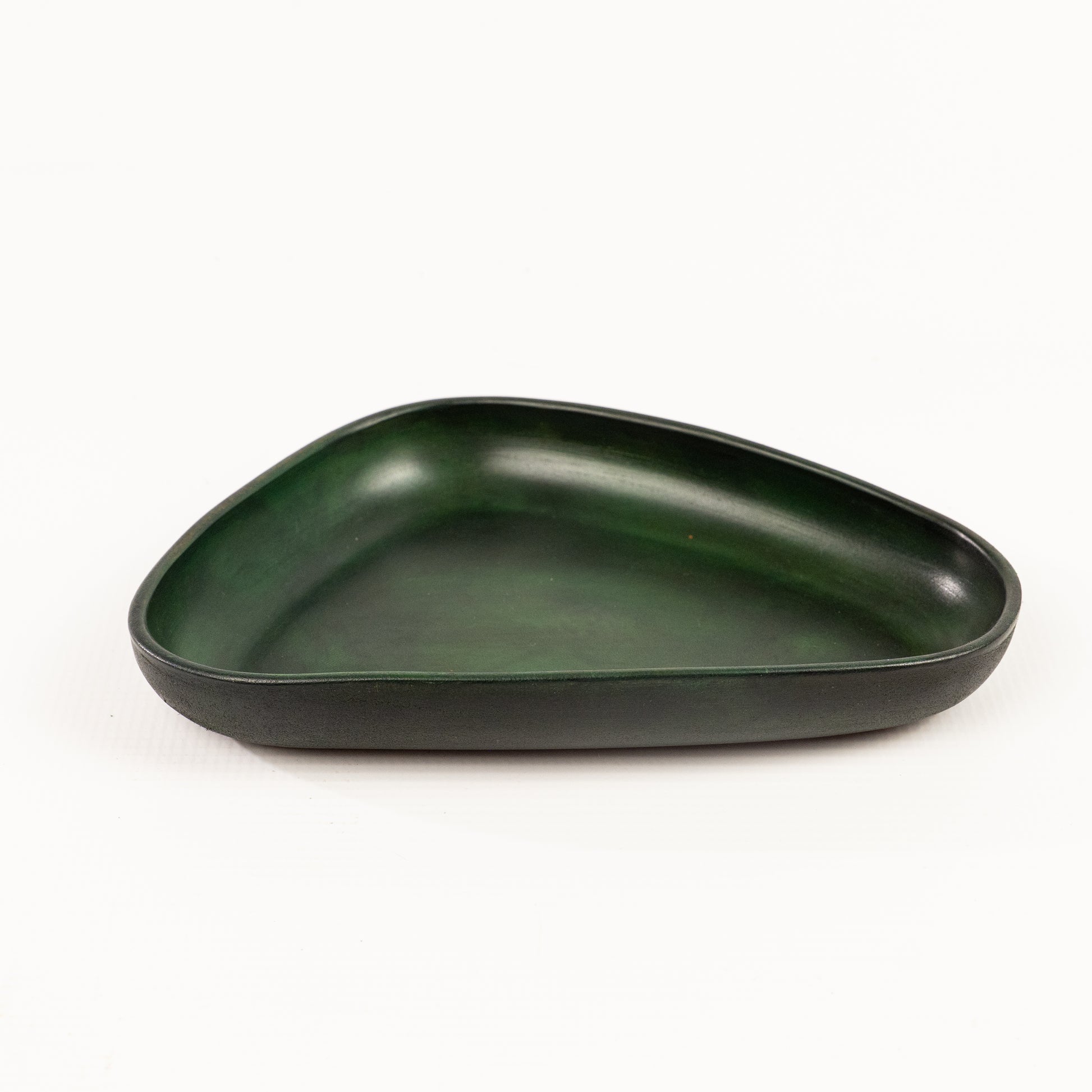 Green Hand Dyed 3D molded leather valet tray transforms any space into a sanctuary of sophisticated organization. Crafted using advanced 3D molding technology, every curve and compartment is perfectly contoured to keep your essentials in perfect order. Handcrafted by Atom Leather.