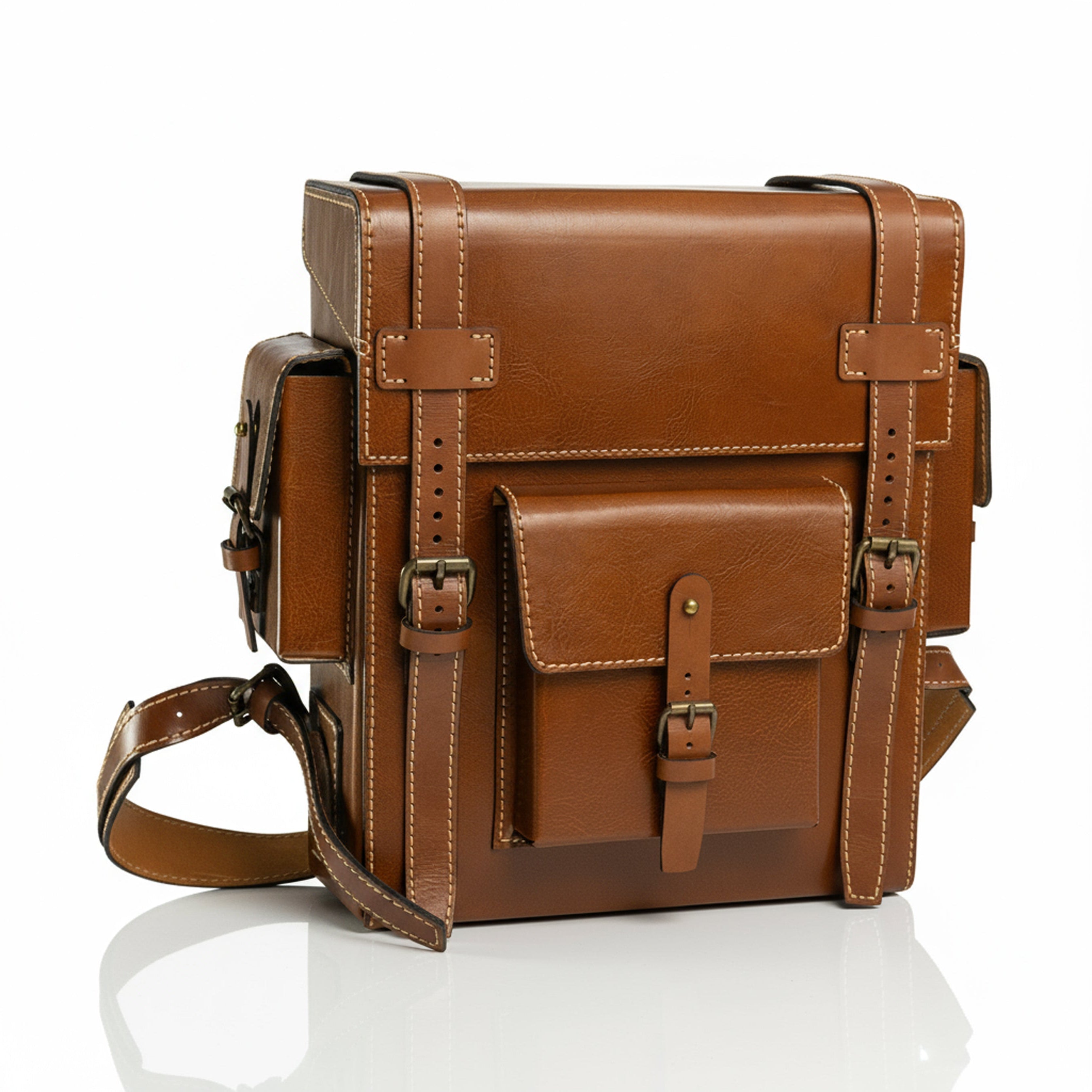 Brown leather Toshiro backpack on a white background, designed and handcrafted by ATOM LEATHER.